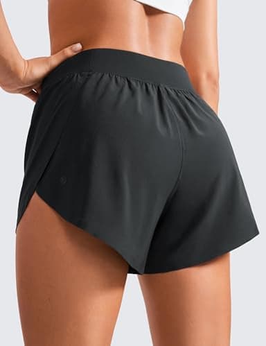 CRZ YOGA Mid Waisted Dolphin Athletic Shorts for Women 4" Lightweight High Split for Gym Workout with Liner Quick Dry Black Medium - Image 4