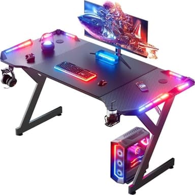 HLDIRECT 55 Inch Gaming Desk with LED Lights, Ergonomic Computer Gaming Table with Carbon Fibre Surface, Sturdy PC Workstation Desk for Home Office with Headphone Hook, Cup Holder, Black - Image 1