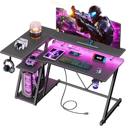 Korfile 40 Inch Gaming Desk with Power Outlet & LED Lights, L Shaped Computer Gaming Table with 3 Tiers Storage Shelves, Corner Gamer Desk with Monitor Stand for Small Space, Carbon Fiber Black - Image 1